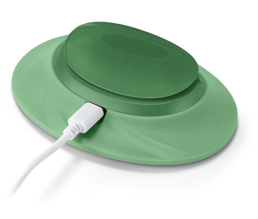 Grünes, kabelloses Ladegerät mit verbundenem, weißen USB-C-Kabel.