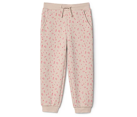 Beige Kinder-Jogginghose mit pinkem Blumenmuster, elastischem Bund, Kordelzug und Bündchen an den Knöcheln.