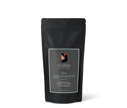 Eine schwarze Tüte YOANDA Lieblingskaffee Espresso mit der Aufschrift "Schokoladig, intensiv 90% Arabica | 10% Robusta".
