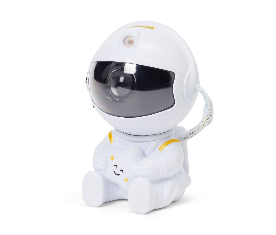 Astronaut in weißem Anzug sitzt und hält einen Stern.
