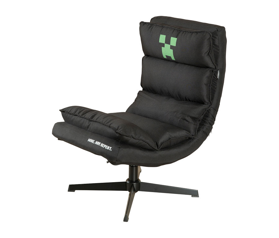 Schwarzer Gaming-Sessel mit grünem Minecraft Creeper-Logo und der Aufschrift „MINE. NAP. REPEAT.“ auf dem Sitz.