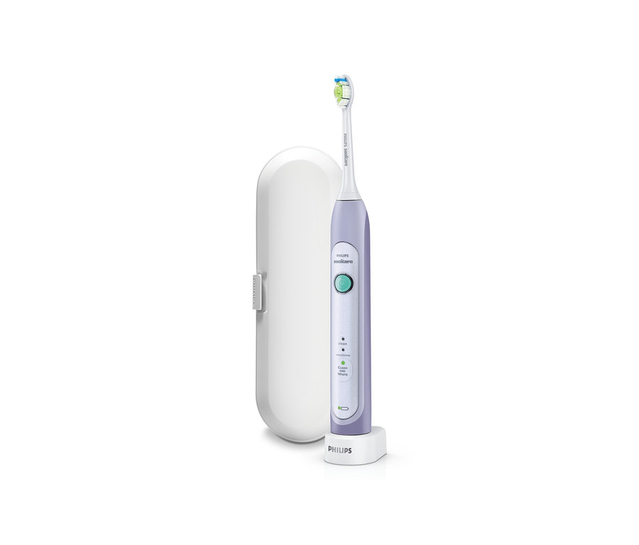 Philips-Sonicare-Schallzahnbürste Healthy White HX6721/35 auf einer Ladestation neben einem weißen Etui.