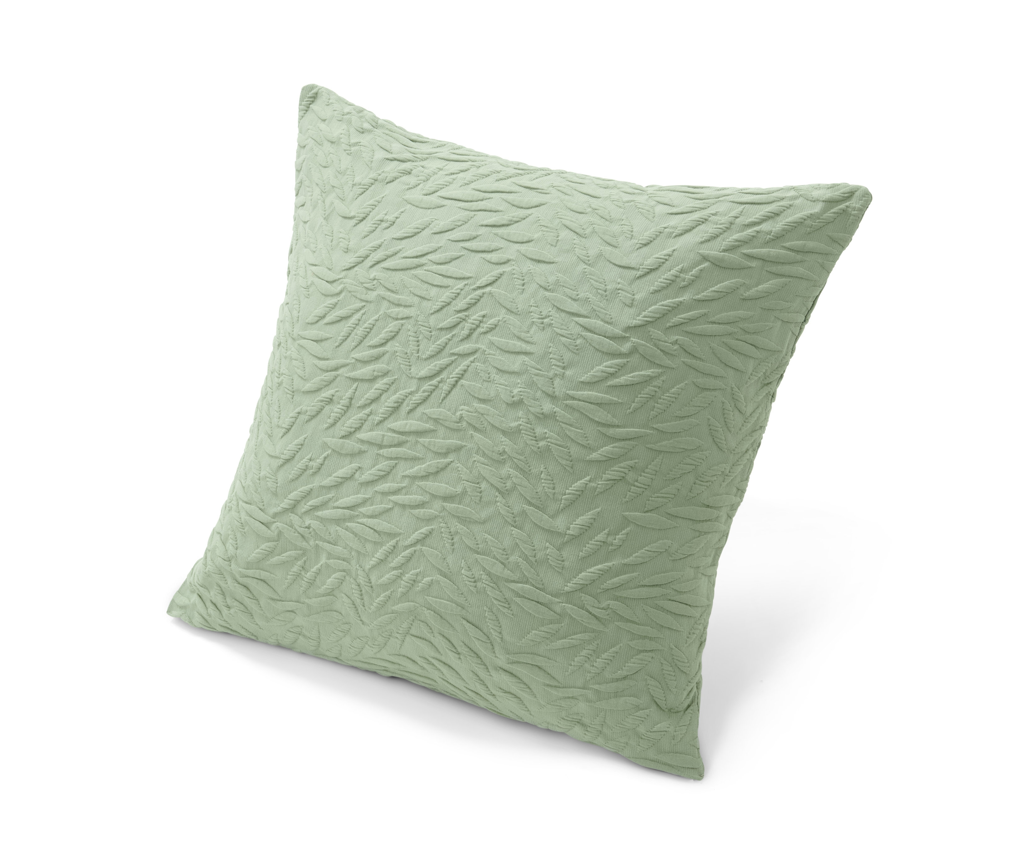 Ein hellgrüner Dekokissen-Bezug mit Blattmuster.