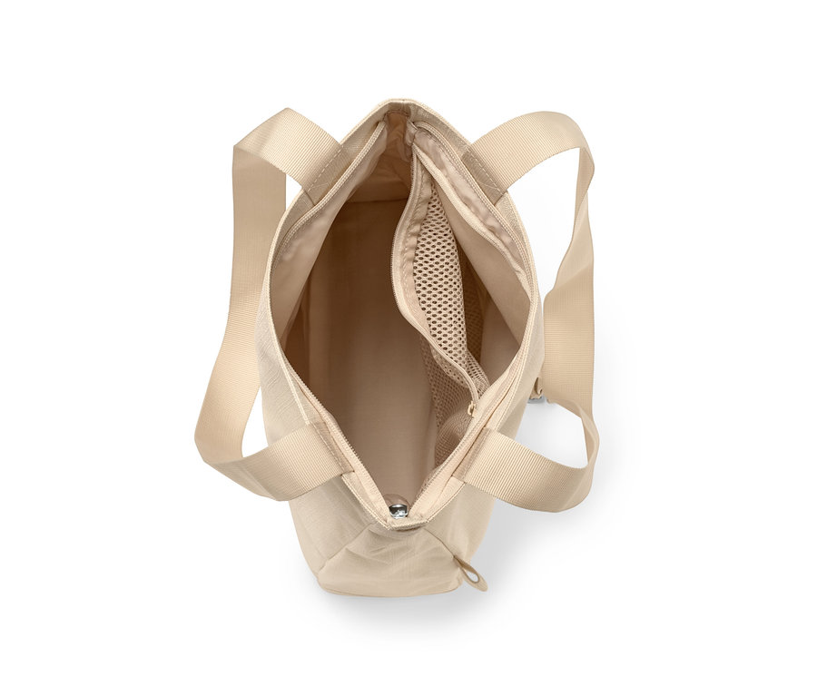 Draufsicht auf eine offene beige Sicherheits-Umhängetasche.