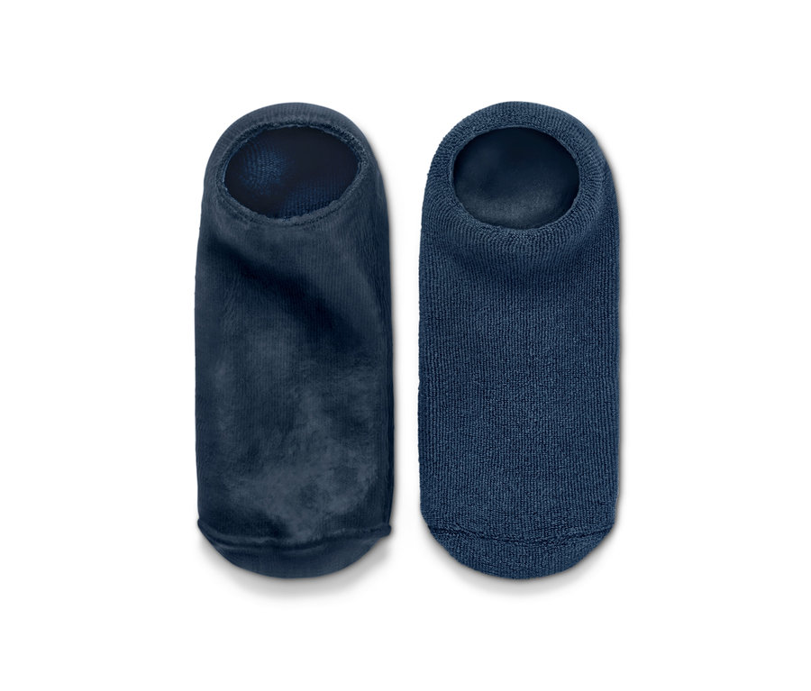 Zwei blaue Fußpflegesocken nebeneinander.