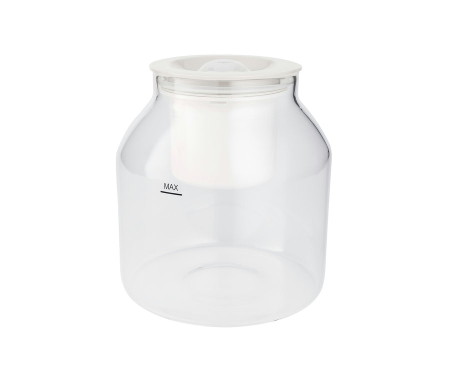 Ein durchsichtiger Behälter mit einem weißen Deckel und der Aufschrift MAX.