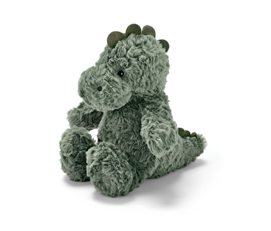 Ein Plüschtier »Dino« sitzt auf einem weißen Hintergrund.