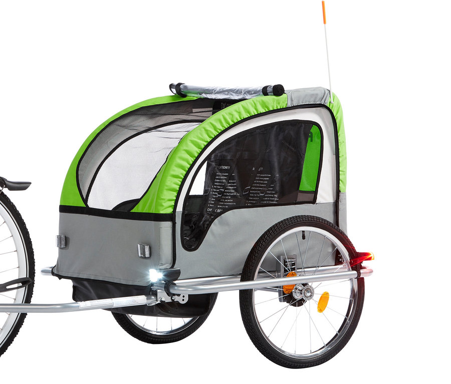 Fahrradanhänger in Grau und Grün, befestigt an einem Fahrrad.