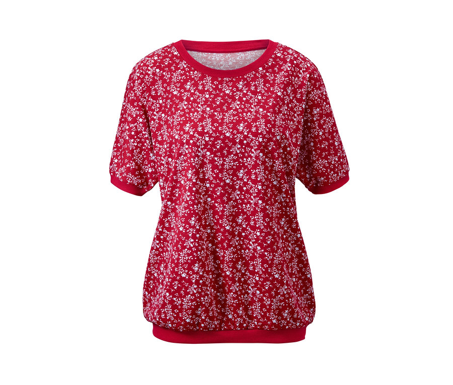 Ein rotes Shirt mit Fledermausärmeln und weißem Blumenmuster.