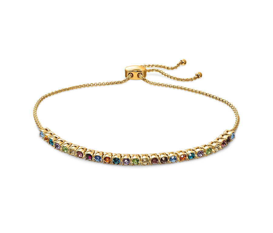 Nahaufnahme eines Armbands Tennis Multicolor mit goldenem Band und bunten Steinen.
