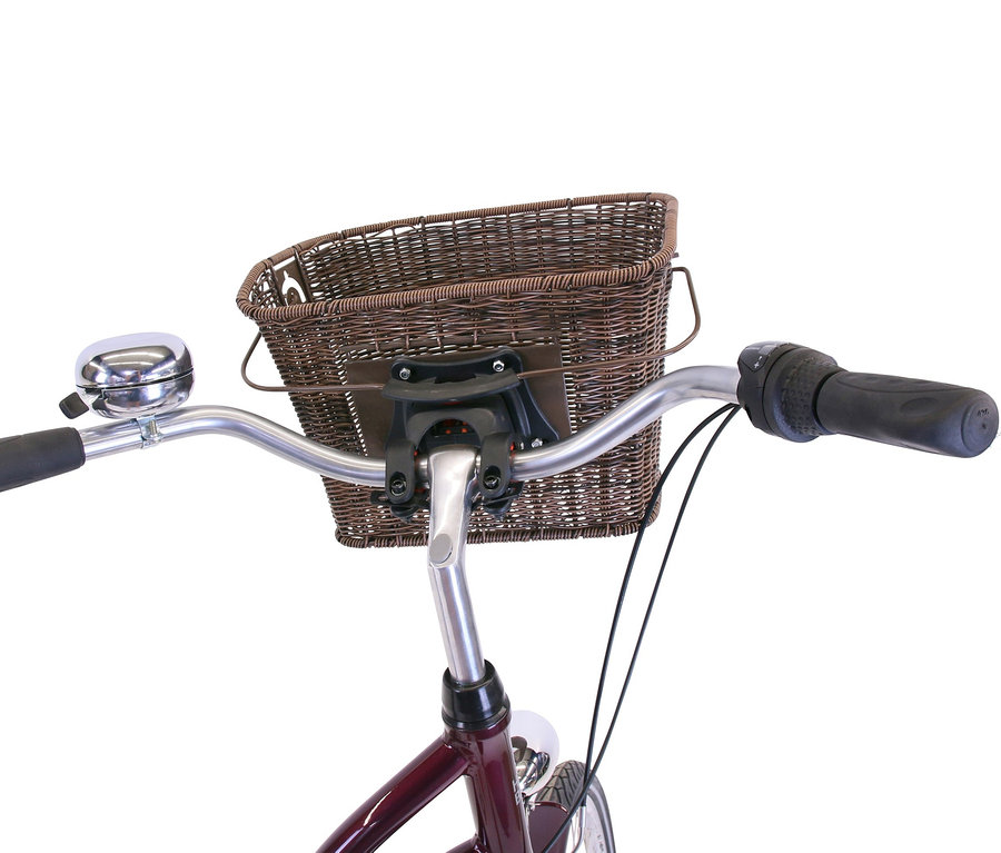 Detailaufnahme eines HAWK Bikes Cityrads "City Classic Joy Bordeaux" mit braunem Weidenkorb und silberner Klingel am Lenker.