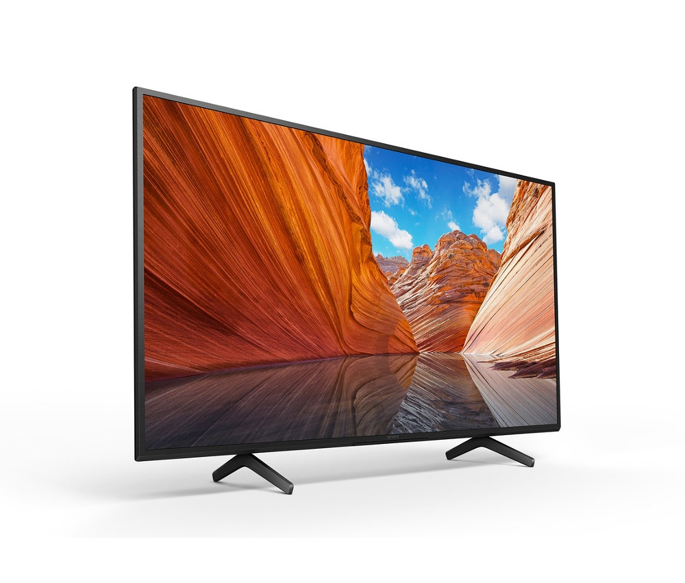 Ein schwarzer Sony KDX80JAEP Fernseher zeigt eine Wüstenlandschaft.