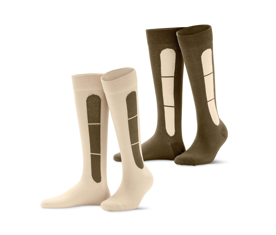 Zwei Paar Reise-Kompressionsstrümpfe in Beige und Khaki.