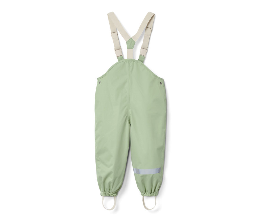 Grüne Regenhose mit beige elastischen Hosenträgern.