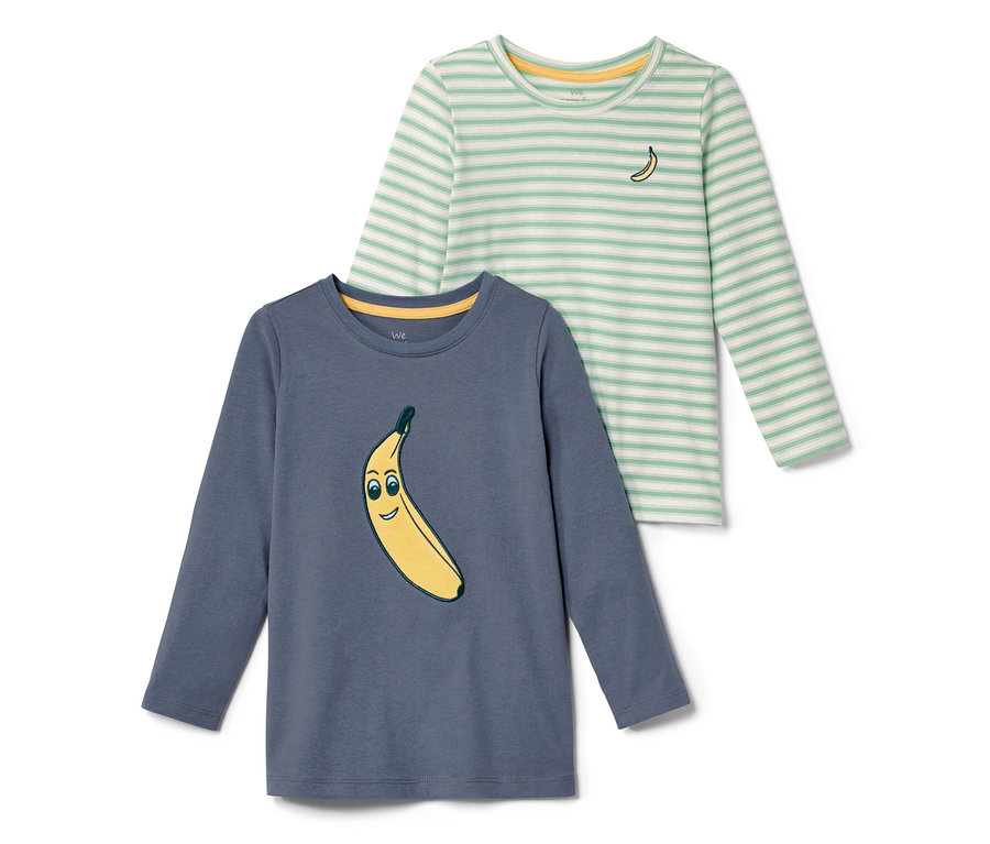 Zwei Kleinkinder-Shirts, eines blau mit Bananenaufdruck, das andere gestreift mit kleiner Banane.