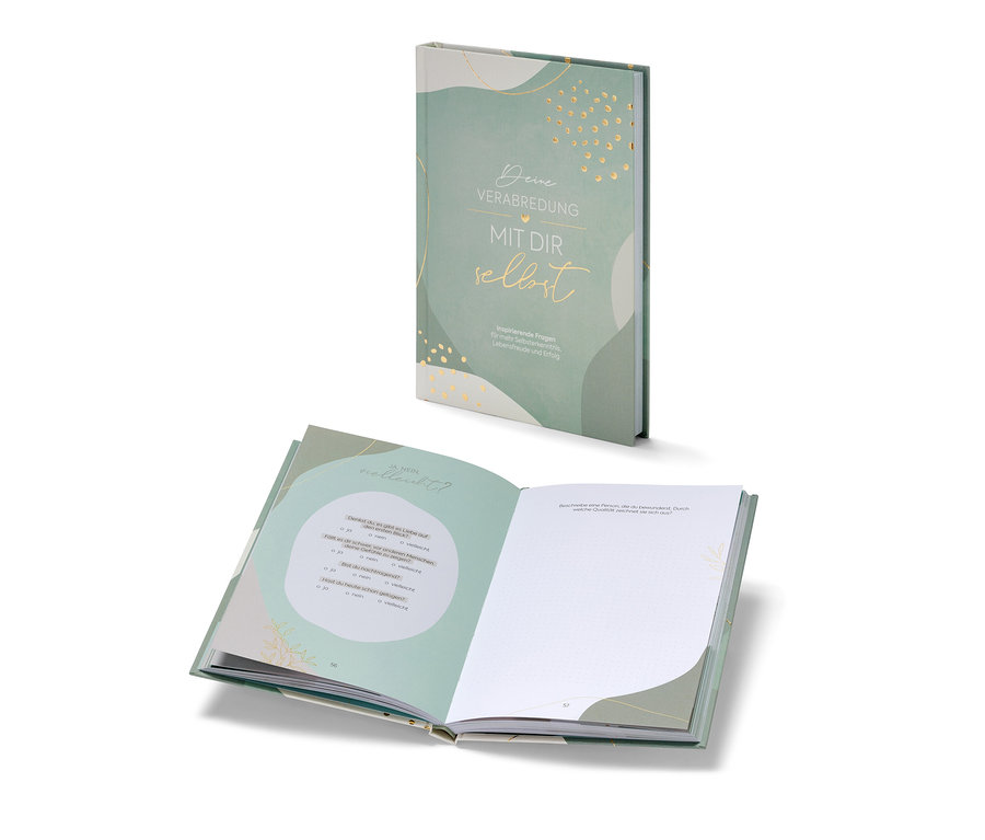 Zwei Exemplare des Buchs »Deine Verabredung mit dir selbst«, eines geschlossen und eines offen.