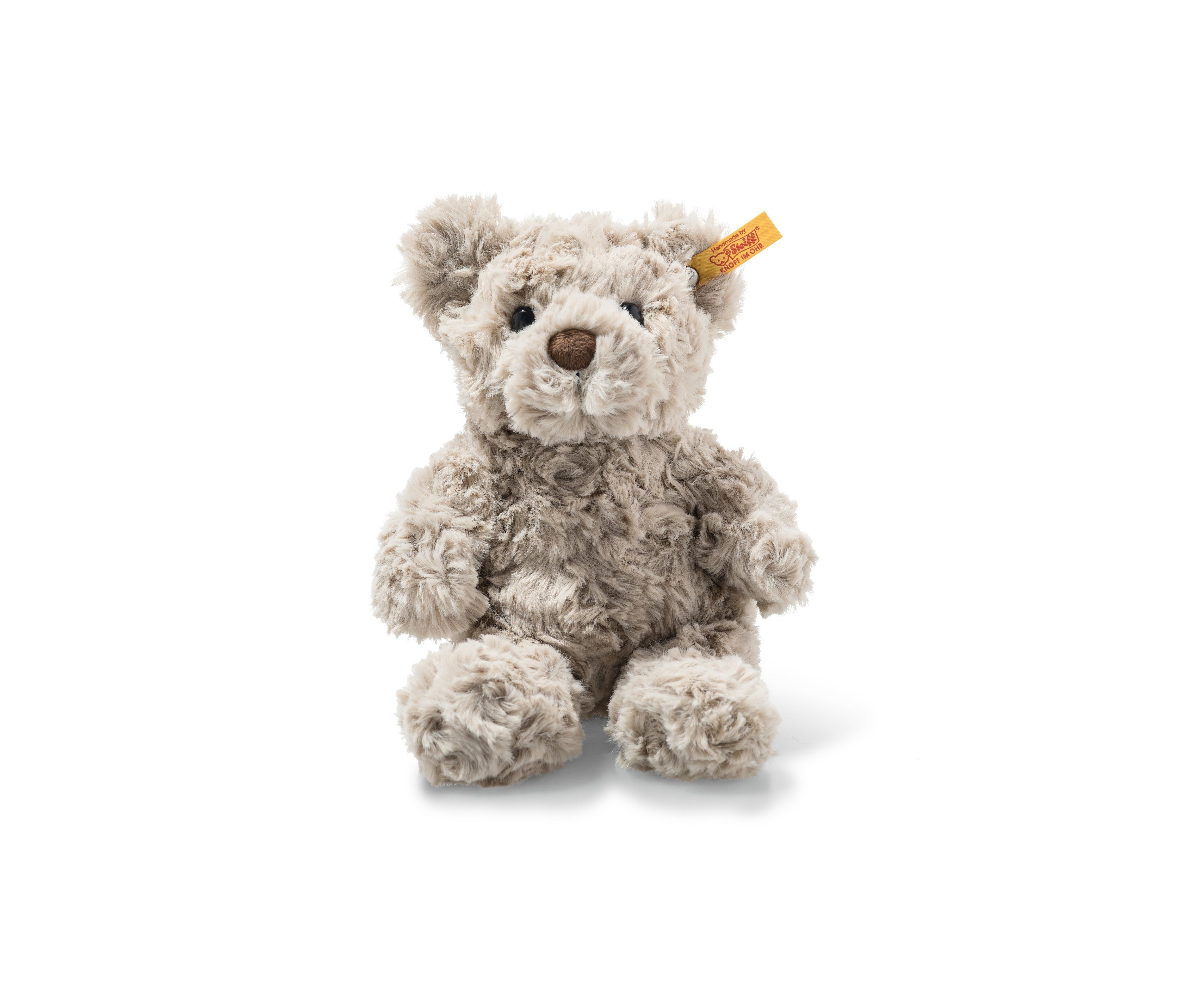 Sitzender Teddybär mit brauner Nase, ein Steiff Honey Teddybär, 18 cm.