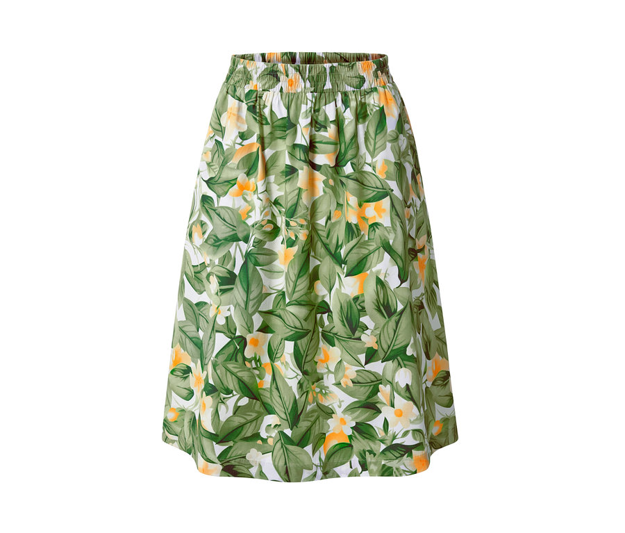 Bedruckter Popeline-Rock mit grünen Blättern und gelben Blüten auf weißem Hintergrund.