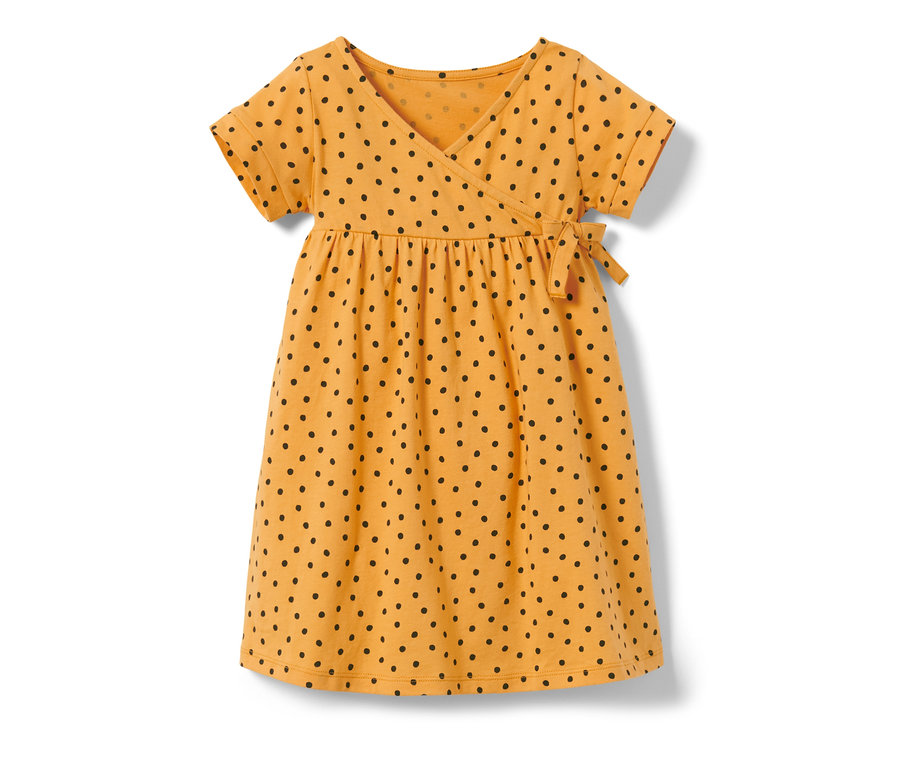 Gelbes Kinder-Jerseykleid mit schwarzen Punkten.