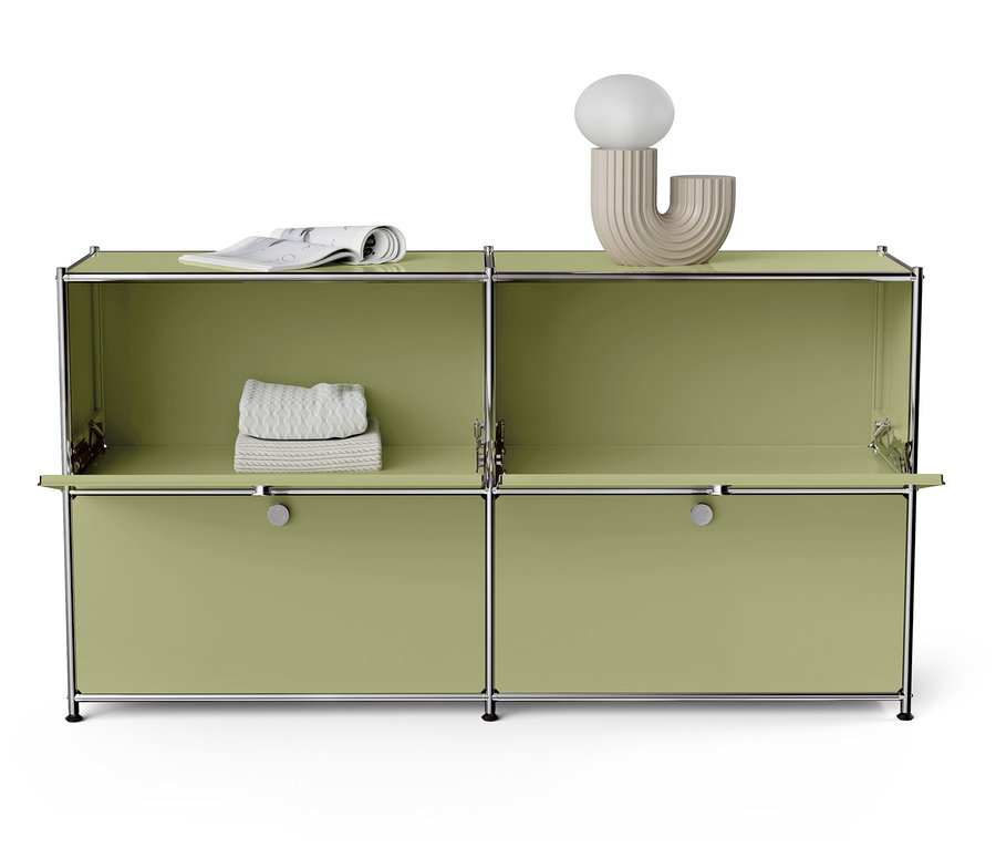 Grüner modularer Schrank mit silbernem Rahmen und weißer Dekoration.