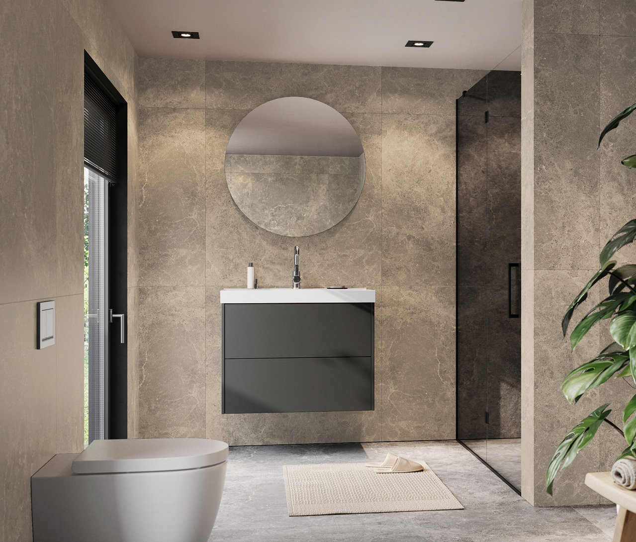 Ein Badezimmer mit einer Toilette, einem Waschbeckenunterschrank mit rundem Spiegel und einer Dusche.