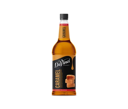 Eine Flasche DaVinci Karamell Sirup mit Karamellbonbons auf dem Etikett.