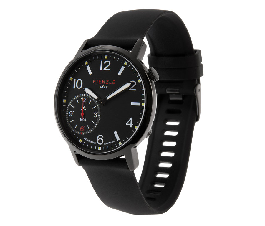 Schwarze Kienzle Armbanduhr mit schwarzem Zifferblatt, weißen Ziffern, einem kleinen Hilfszifferblatt mit roten Akzenten und schwarzem Kautschukarmband.