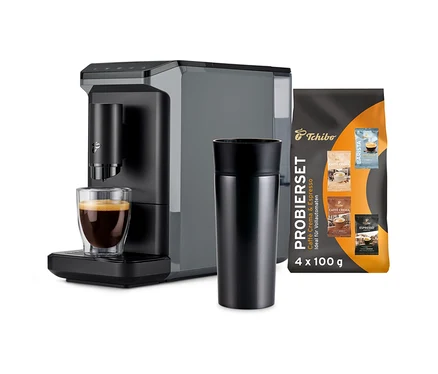 Grauer »Esperto mini« Vollautomat mit Thermobecher, Glas Espresso und Tchibo Kaffeebohnen Probier-Set.