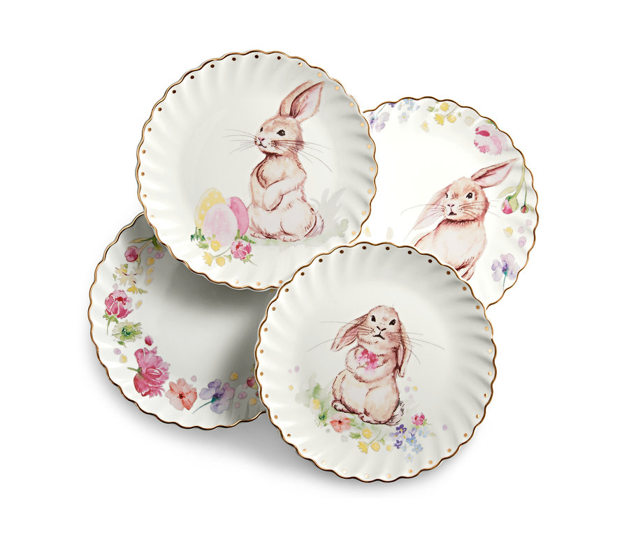 Vier Dessertteller mit Glanzgolddekor, verziert mit Hasen- und Blumenmotiven.
