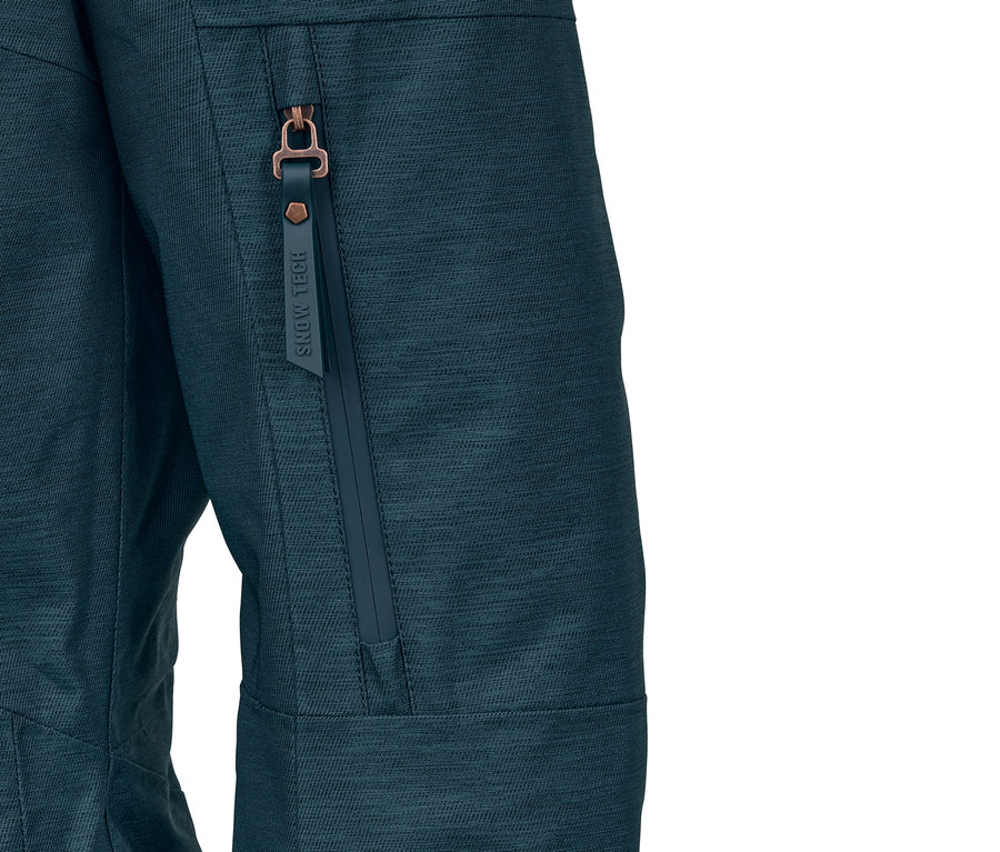 Detailansicht einer petrolfarbenen Ski- und Snowboardjacke mit Reissverschluss an der Tasche.
