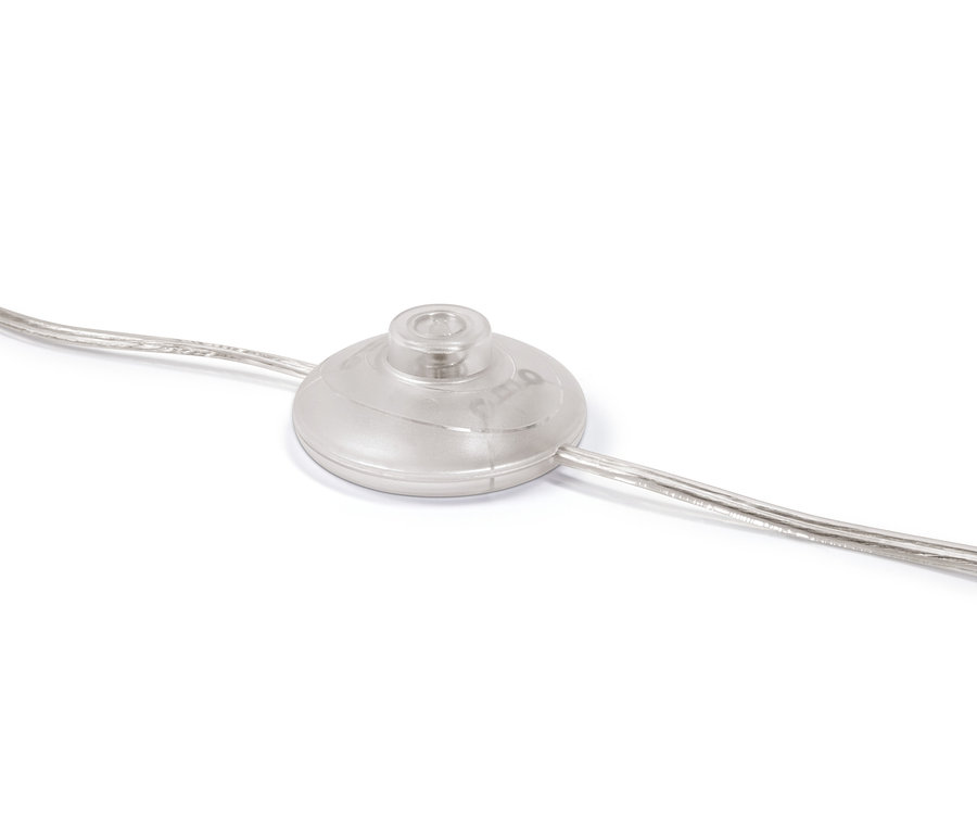 Detailaufnahme des Fußschalters der Stehleuchte »Glaskugel«.