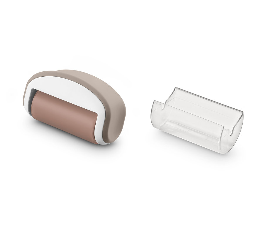 Ein beiger Fusselroller und seine transparente Abdeckung.