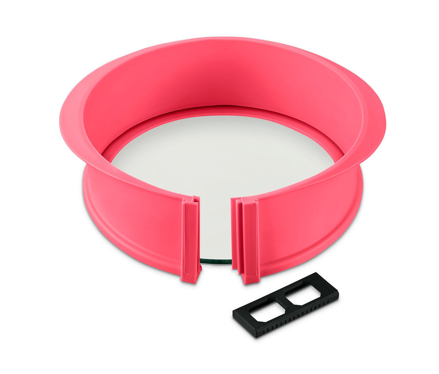 Eine rosafarbene 2-in-1-Spring- und Tarteform mit abnehmbarem Boden und einem schwarzen, rechteckigen Befestigungsclip.