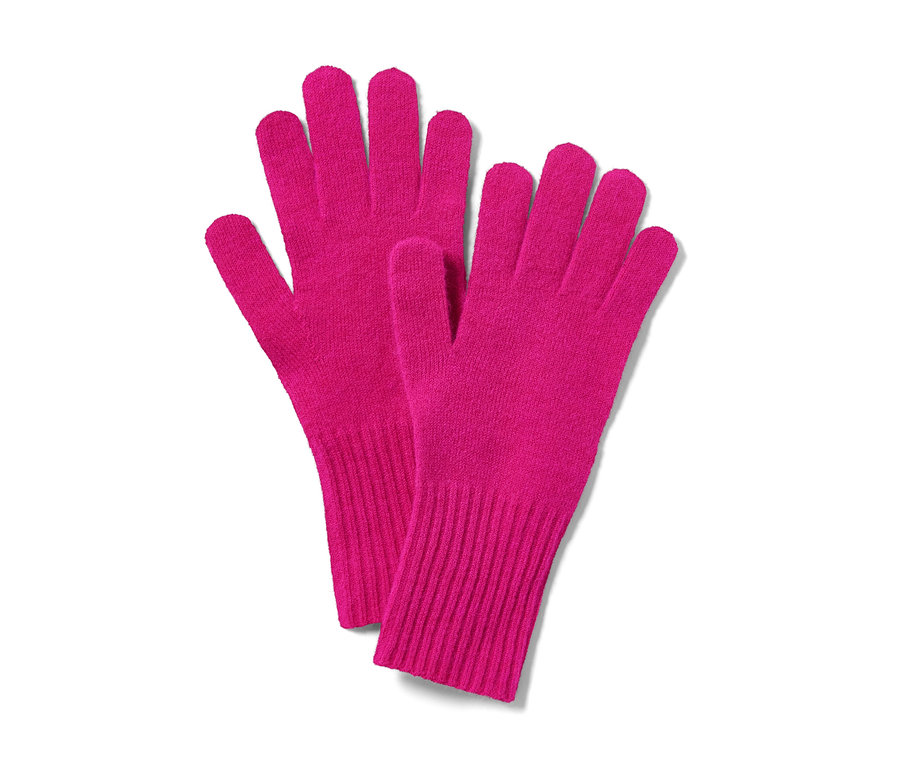 Ein Paar pinke Strickhandschuhe mit Wolle.