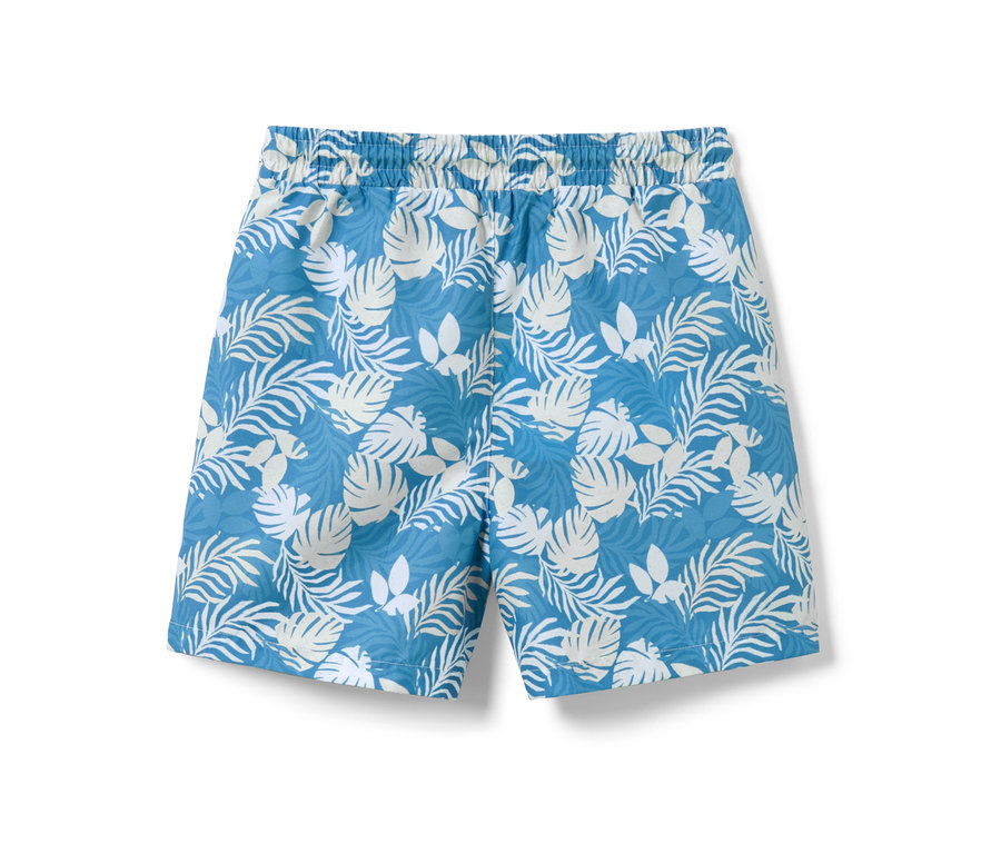 Kinder-Boardshorts mit weißem Blätterdruck auf blauem Grund.