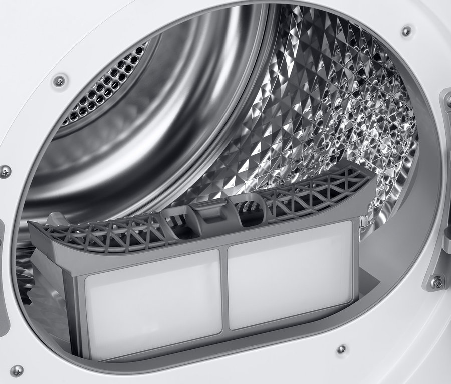 Inneres eines weißen SAMSUNG DV90T5240AW/S2 Wärmepumpentrockners mit Textilstaubfilter.
