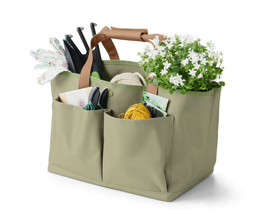 Eine grüne Gartentasche mit Blumen und Werkzeugen.