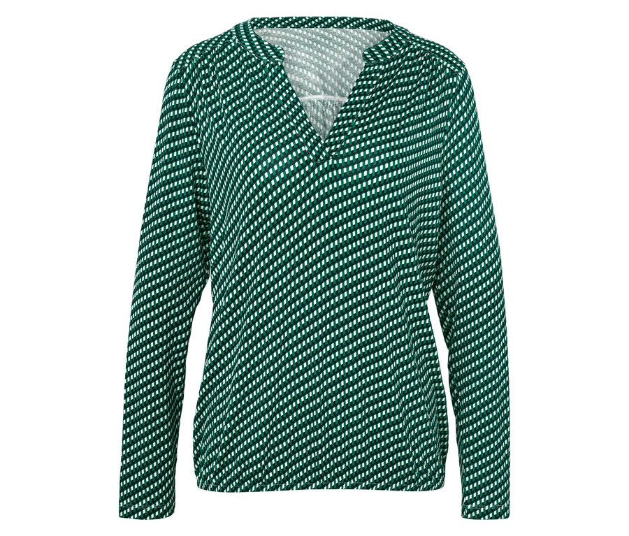 Grüne Damenbluse mit weißen Punkten und langen Ärmeln.