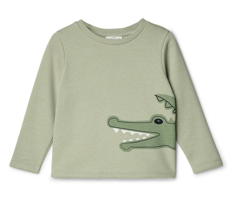 Grünes Langarmshirt mit Krokodil-Motiv.