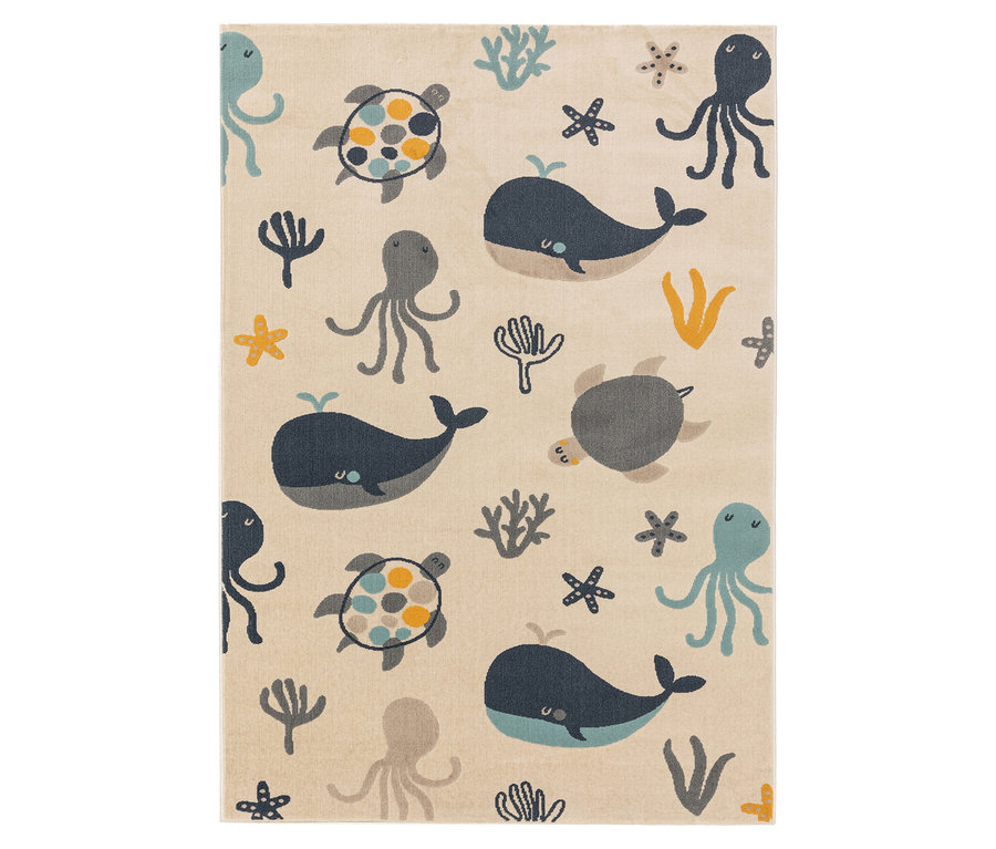 Ein beiger Teppich mit Walen, Schildkröten und Kraken.