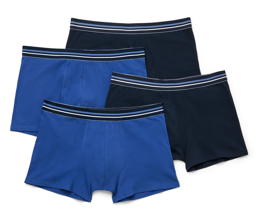 Vier Slipboxer, zwei königsblau und zwei marineblau, mit gestreiften Bündchen, liegen gestapelt.