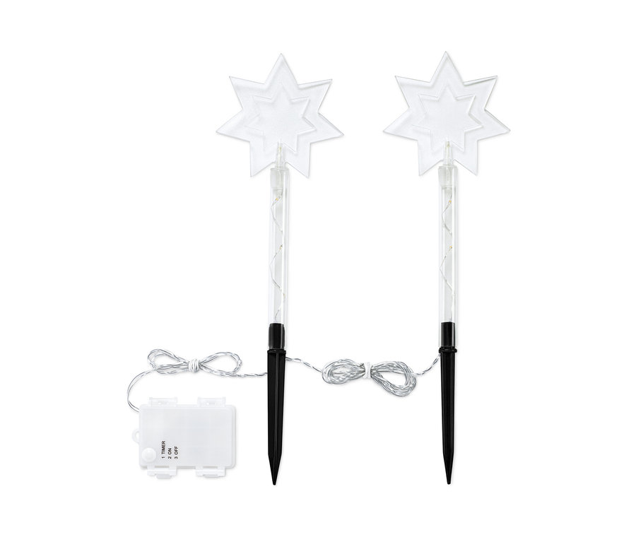 Zwei LED-Gartenstecker in Sternform.