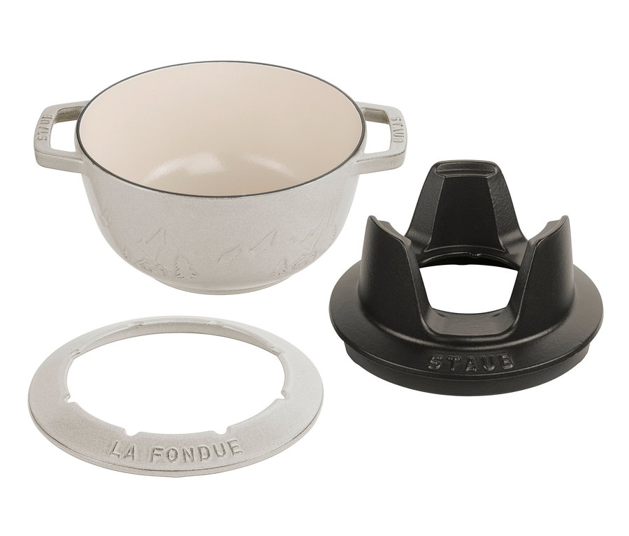 Weißes STAUB Fondue-Set mit schwarzem Ständer.