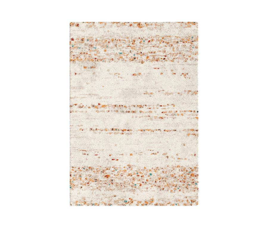 Detailansicht eines beigen Teppichs »Himalaya« mit Farbflecken.