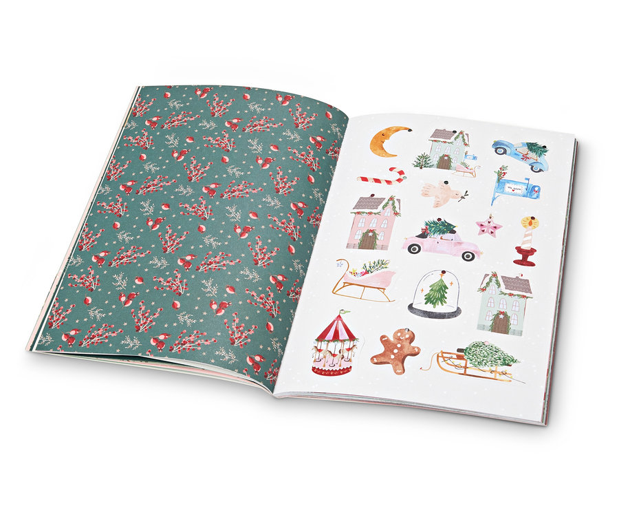 Offenes Buch mit Seiten mit Weihnachtsmotiven.