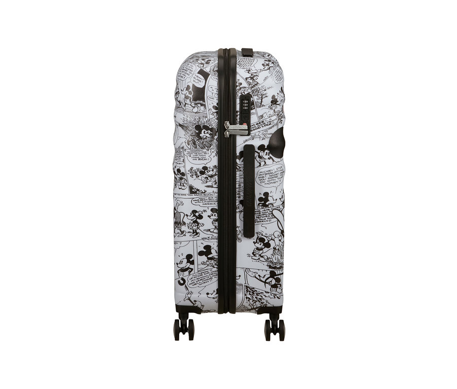 Ein mittelgroßer American Tourister Wavebreaker »Minnie Mouse« Koffer mit schwarz-weißem Mickey Mouse Comic-Muster.