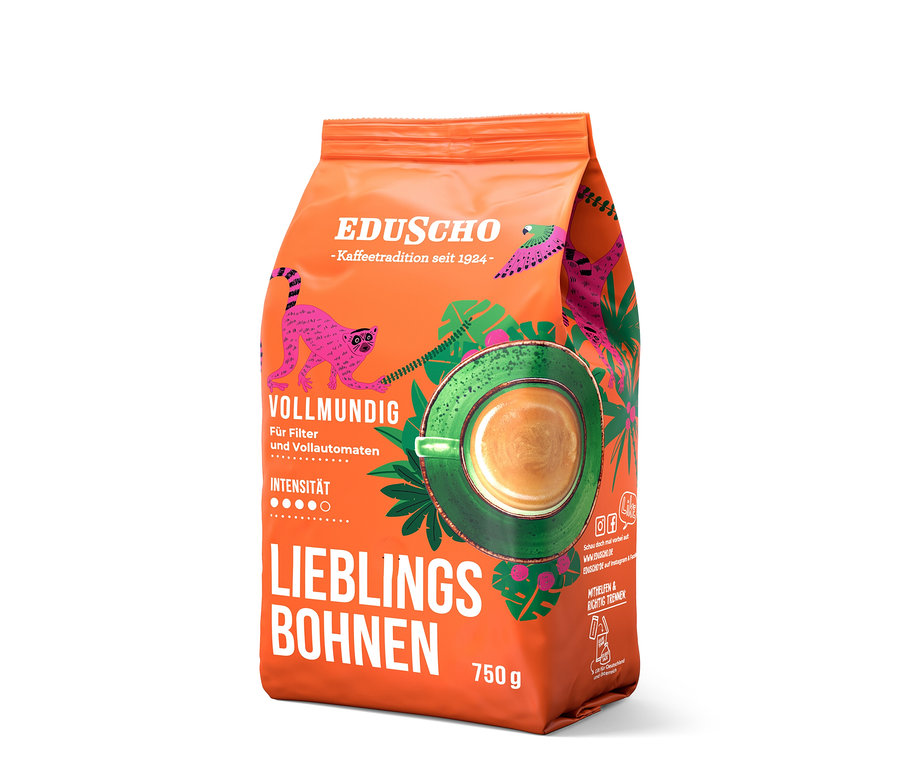 Orangefarbene Packung Eduscho Lieblingsbohnen Vollmundig mit einer Abbildung einer Tasse Kaffee und tropischen Motiven.