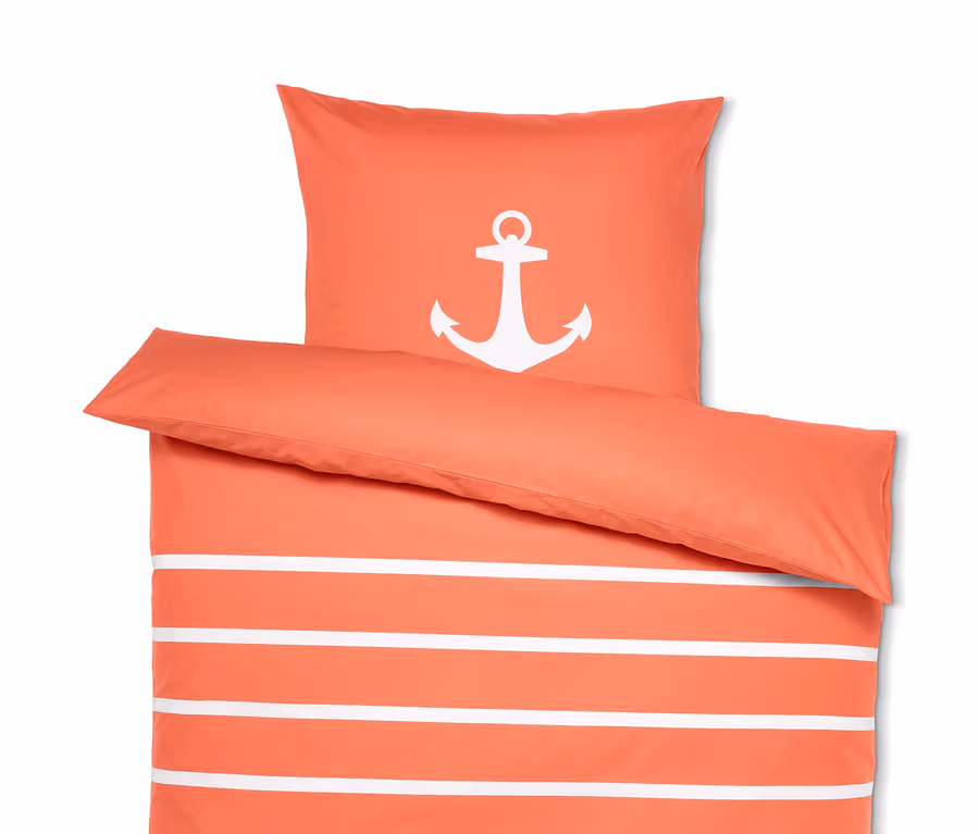 Orange-weiss gestreifte Renforcé-Wendebettwäsche mit Anker-Motiv.