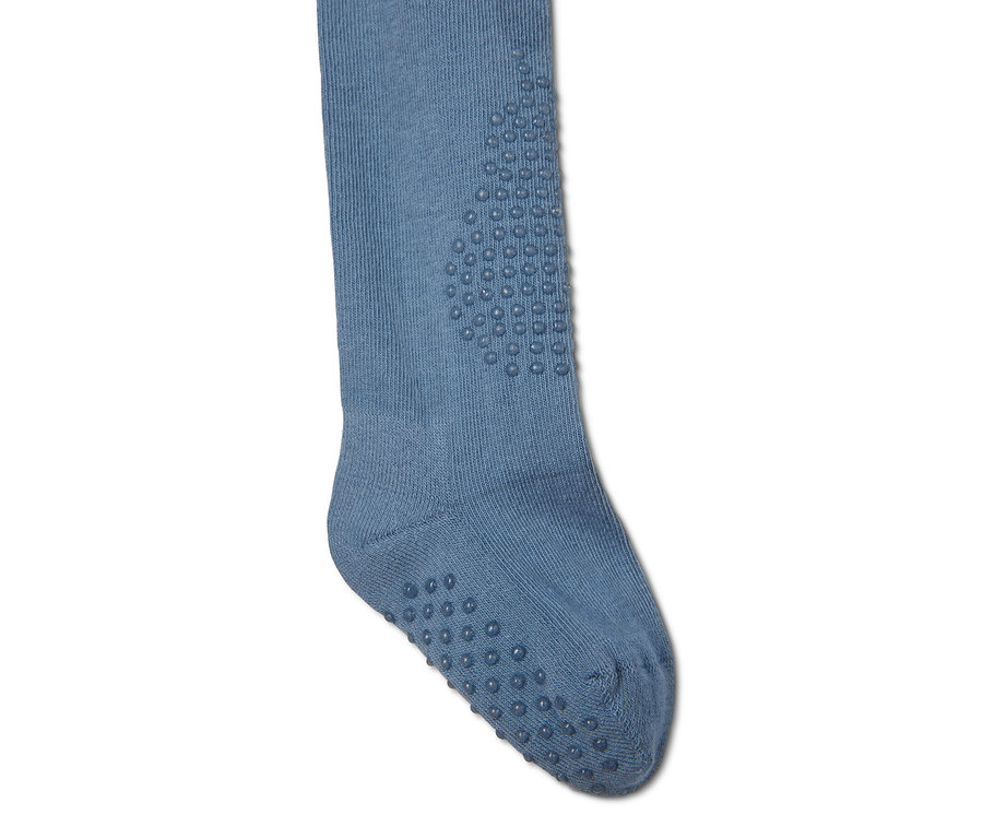 Detailaufnahme einer blauen Strumpfhose mit Anti-Rutsch-Noppen.