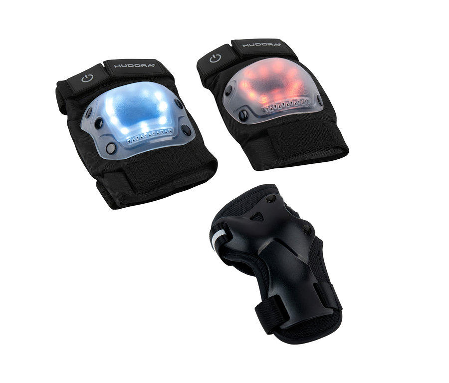 Zwei HUDORA LED-Protektoren-Sets mit blauem und rotem Licht und ein HUDORA-Handgelenkschoner auf weißem Hintergrund.